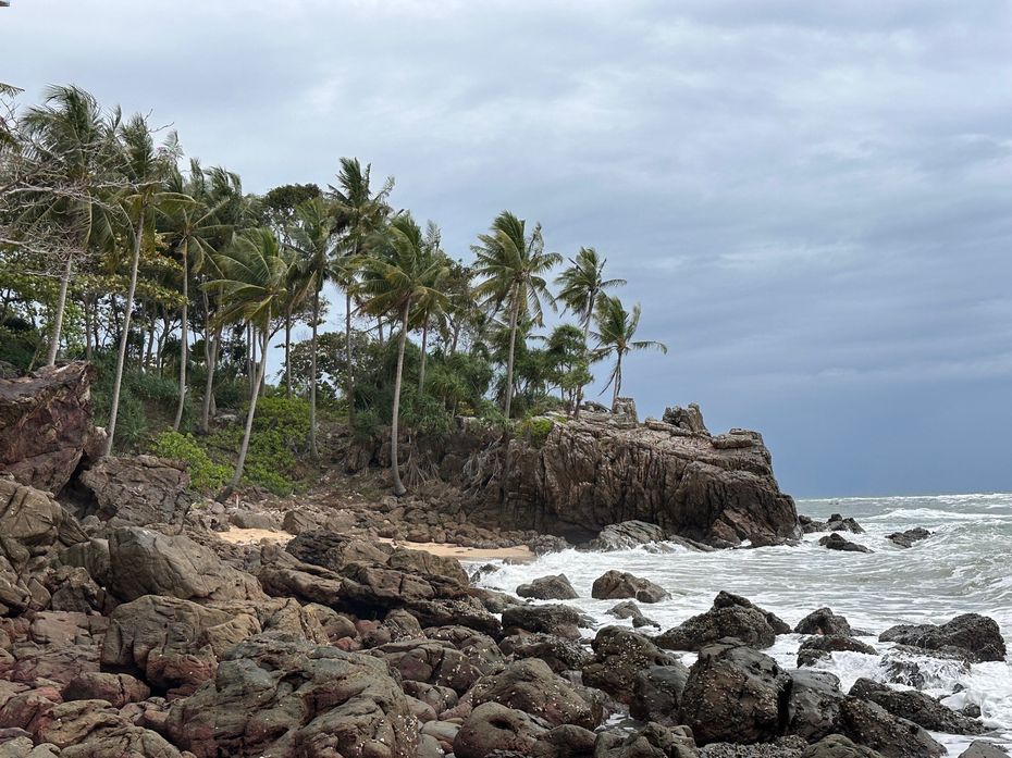 Rocky coastline with palm trees on Koh Lanta, Thailand, captured during a one month stay on the island