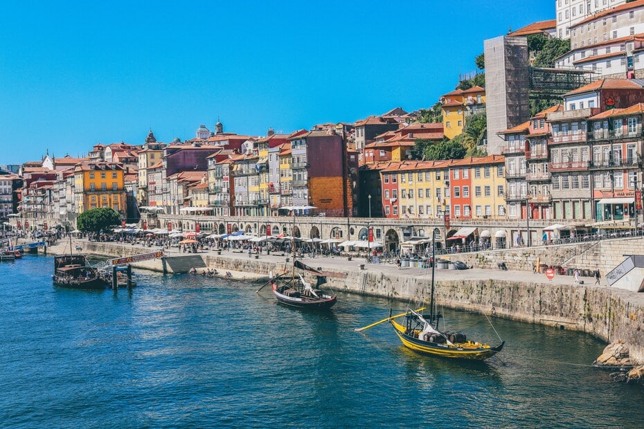 Colourful riverside buildings and boats in Porto, one of the safest places in Portugal for solo female travellers