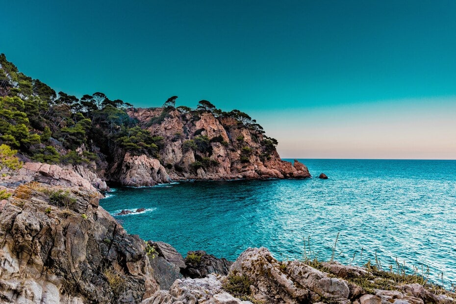 Rocky coastline and turquoise sea in Spain, a safe and scenic destination for solo female travellers